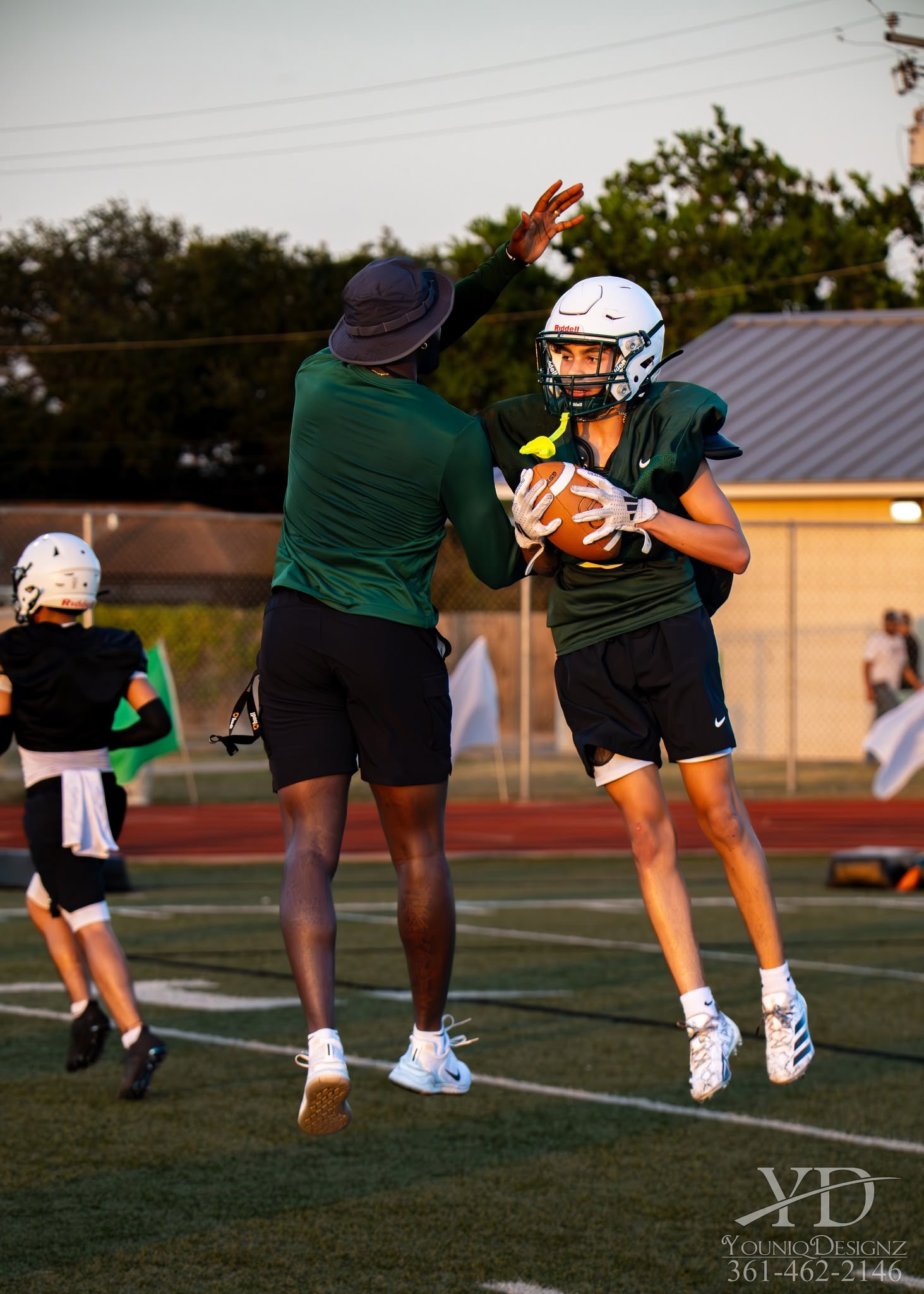 Coach giving instruction to player